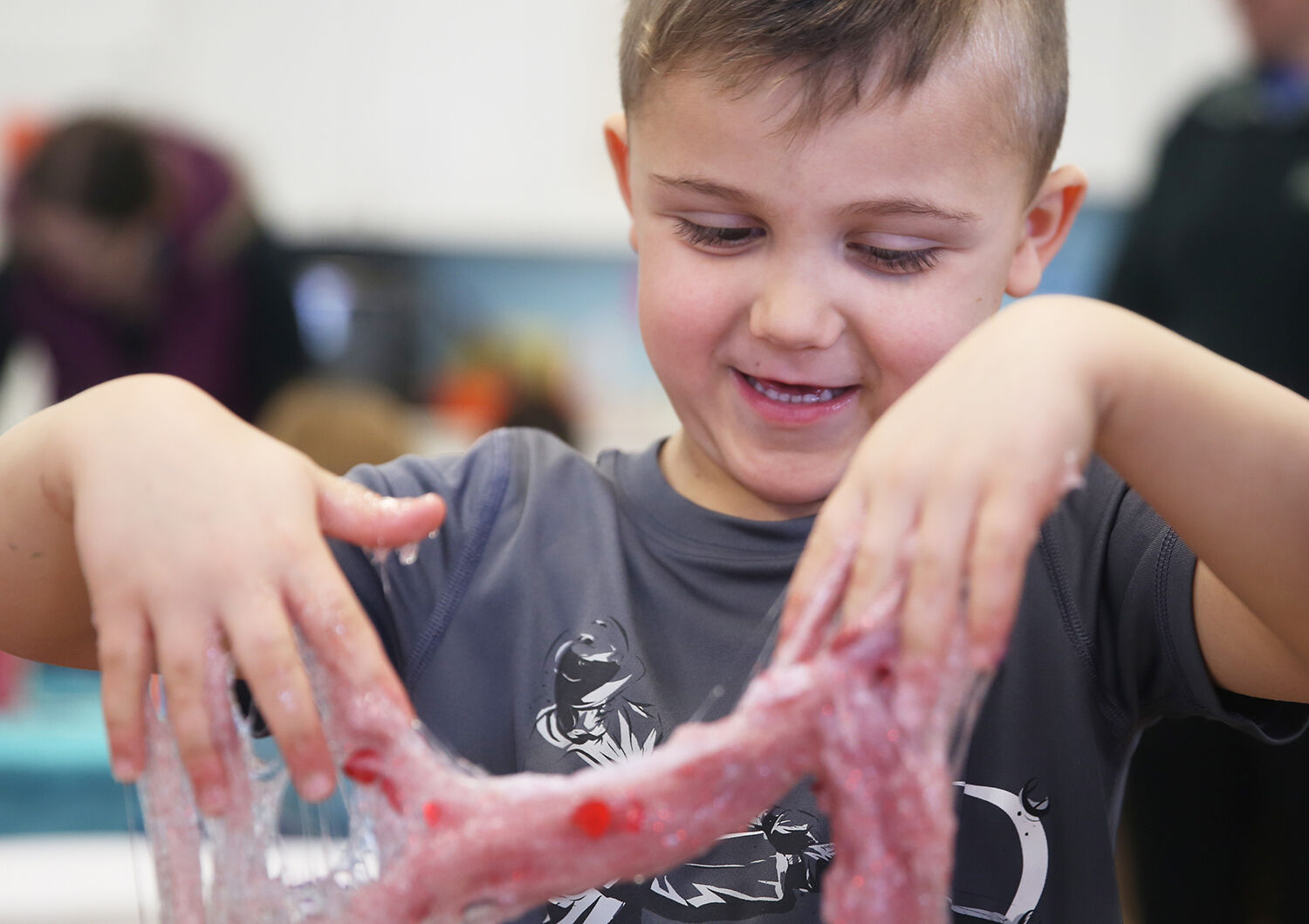 Connor Jones, 5, laughs as his valentines goop slips off his hands